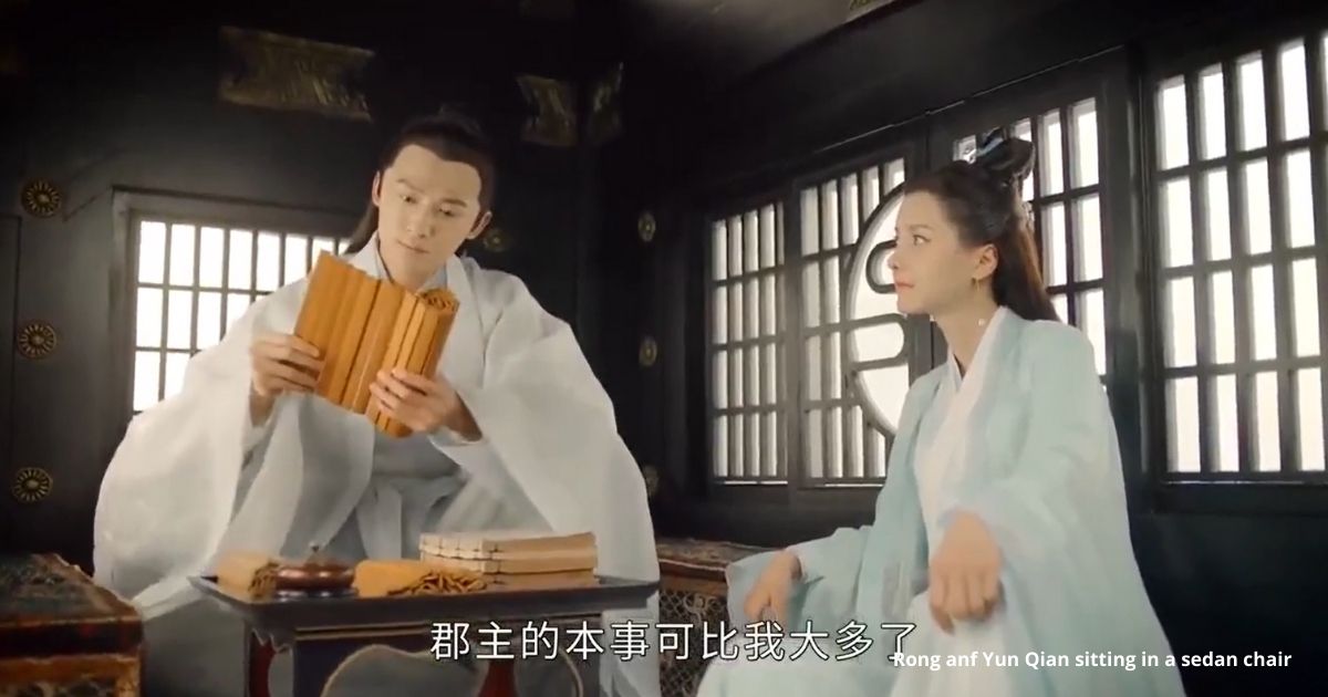 Rong and Yun Qian sitting in a sedan chair