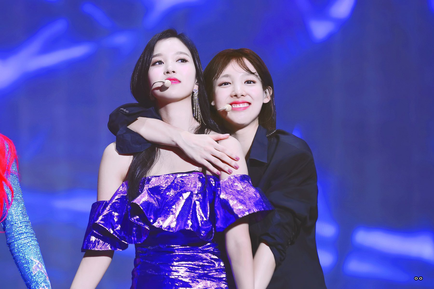 Nayeon from Twice hugging and clinging to other members