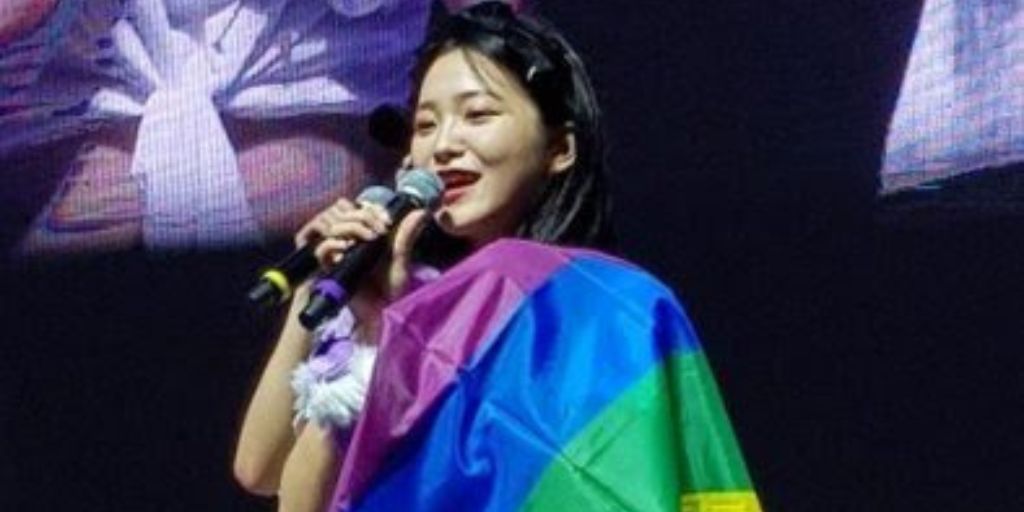 Kpop idols showing off pride flags