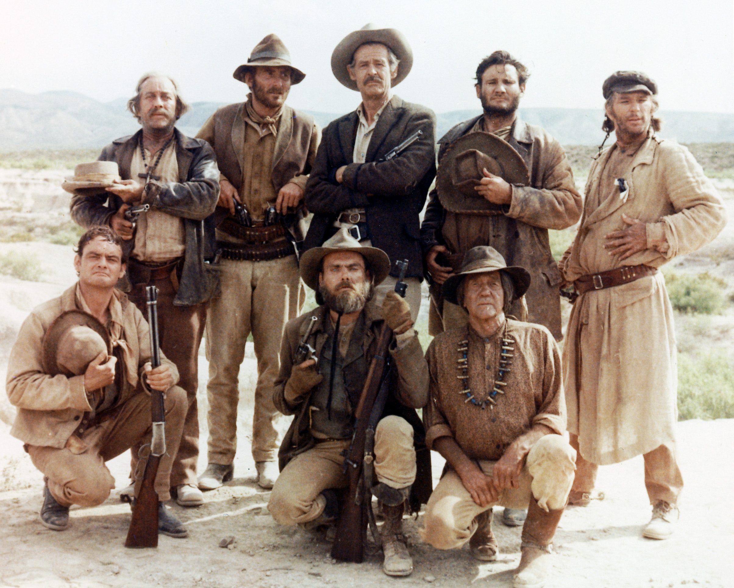 Robert Ryan (1909-1973), US actor, L Q Jones, US actor, and Strother Martin (1919-1980), US actor, among other members of the cast as they pose for a group portrait issued as publicity for the film, 'The Wild Bunch', 1969. The western, directed by Sam Peckinpah (1925-1984), starred Ryan as 'Deke Thornton', Jones as 'TC', and Martin as 'Coffer'. (Photo by Silver Screen Collection/Getty Images)