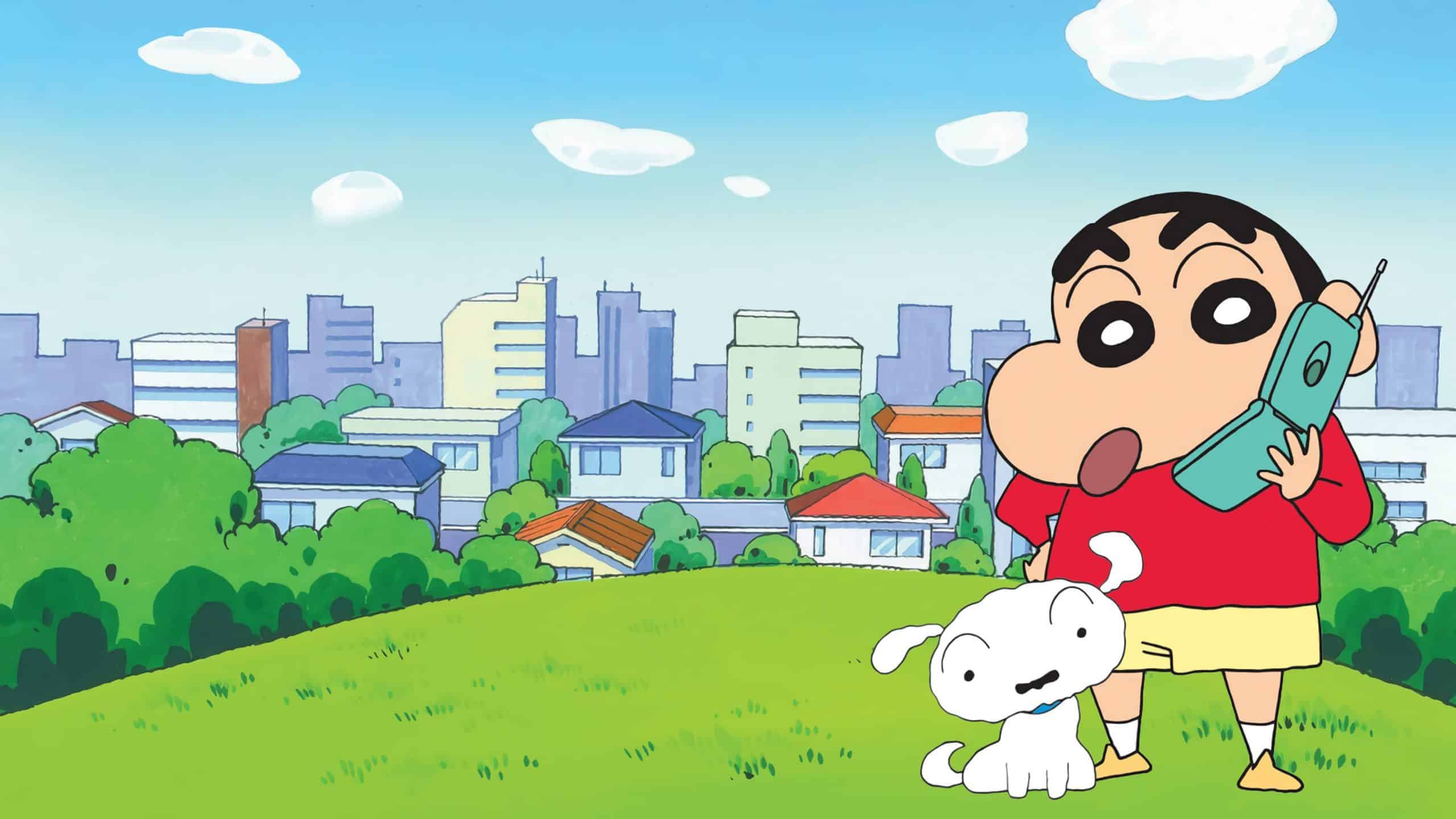 Shinchan holding a cellphone and standing beside his dog Shiro.