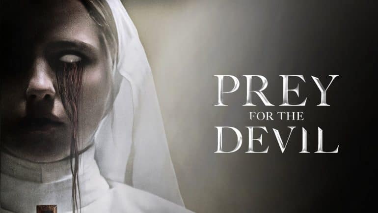 poster contains a scary looking nun with the title of the movie