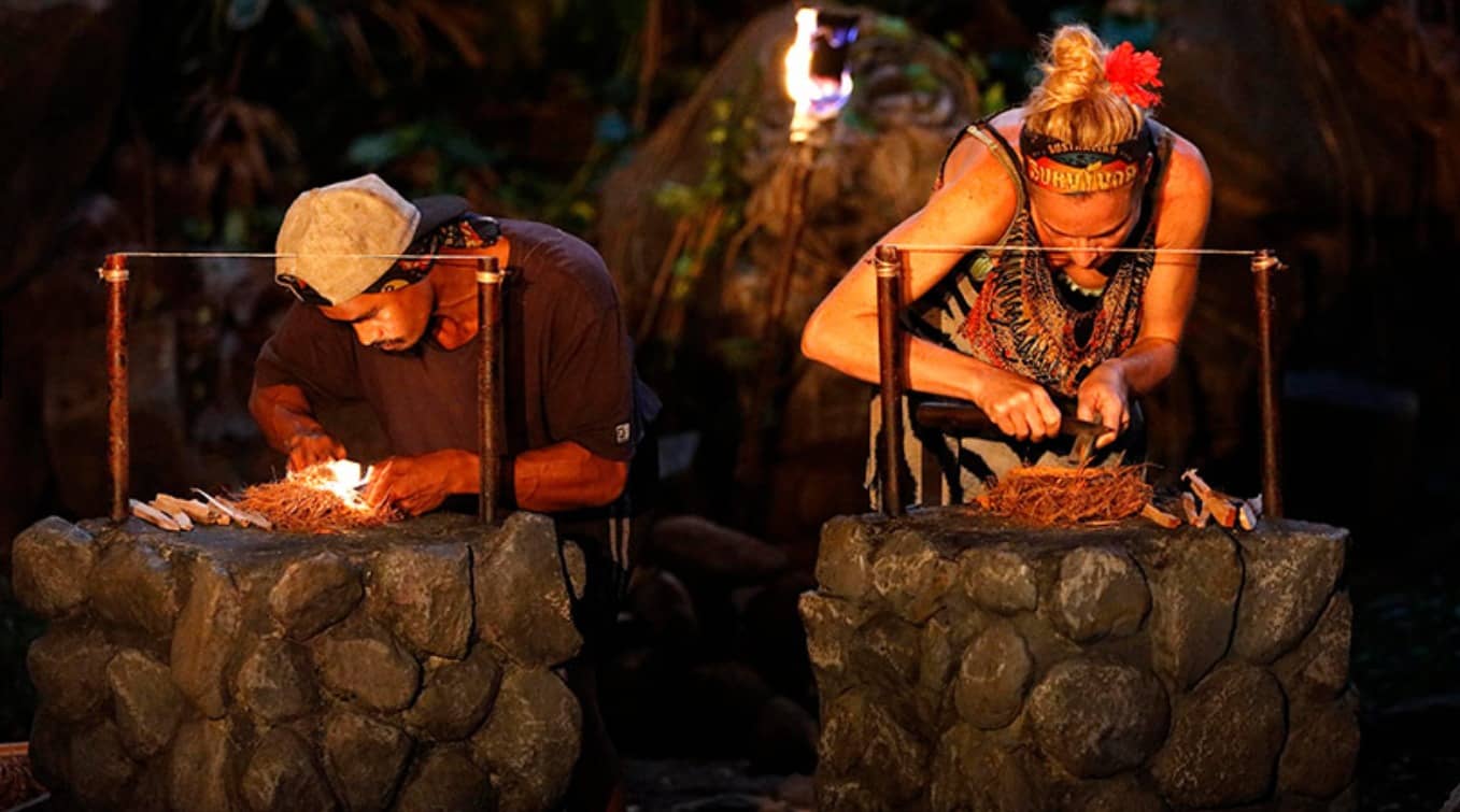 Contestants creating fire to cook