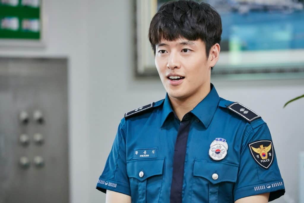 Kang Haneul as the cop and the main lead in the drama, When the Camellia Blooms