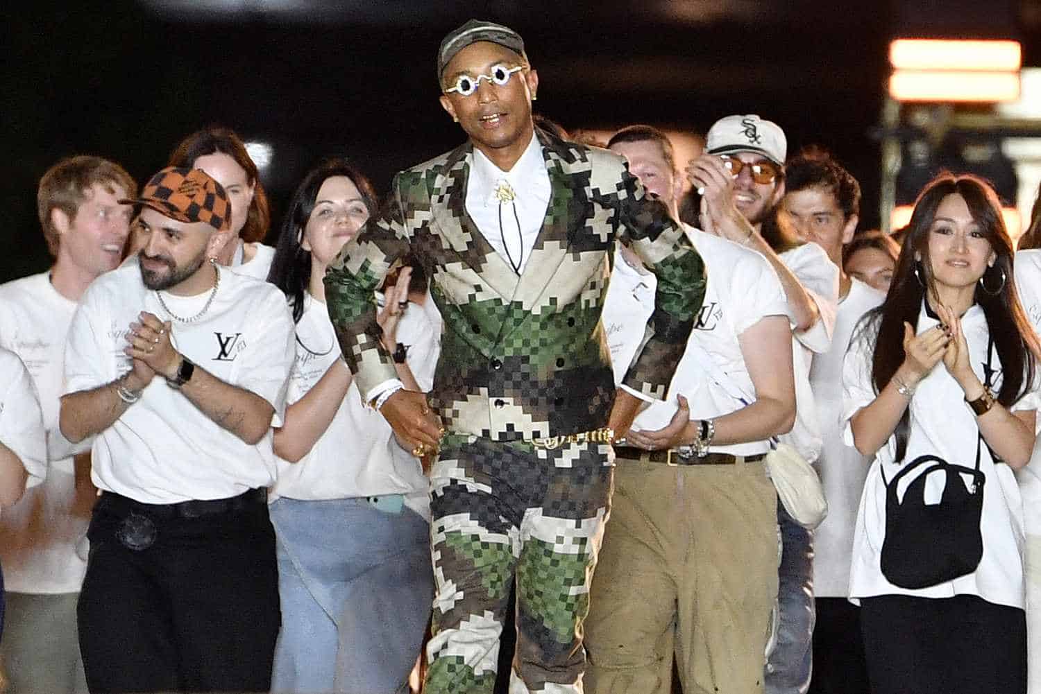 Pharrell Williams with his design team for his LV debut show