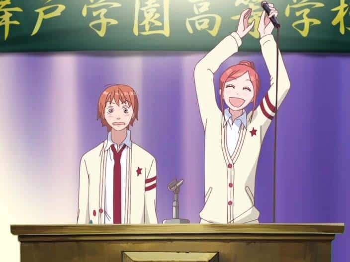 Risa and Atsushi, high school students at the podium of the school