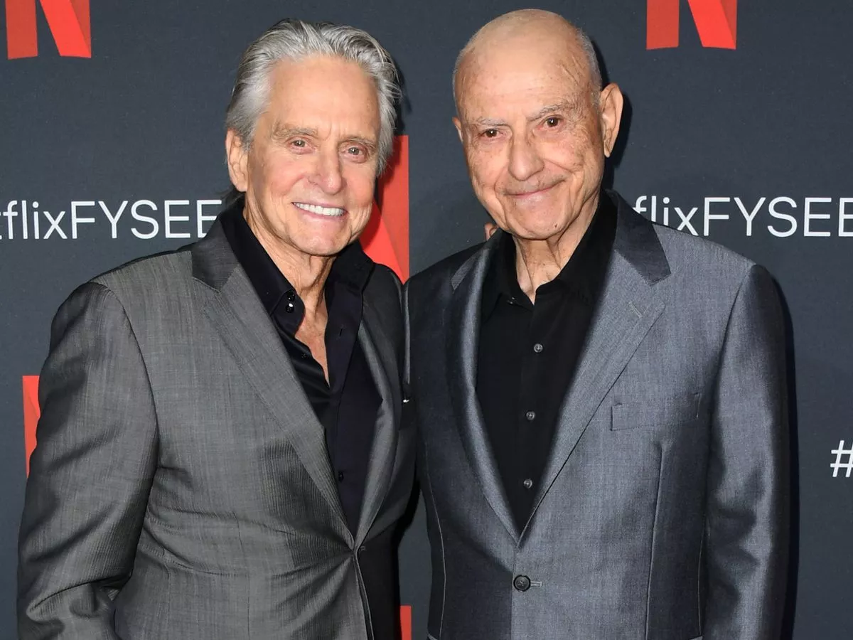 Alan Arkin with his co-star Michael Douglas at a Netflix event.