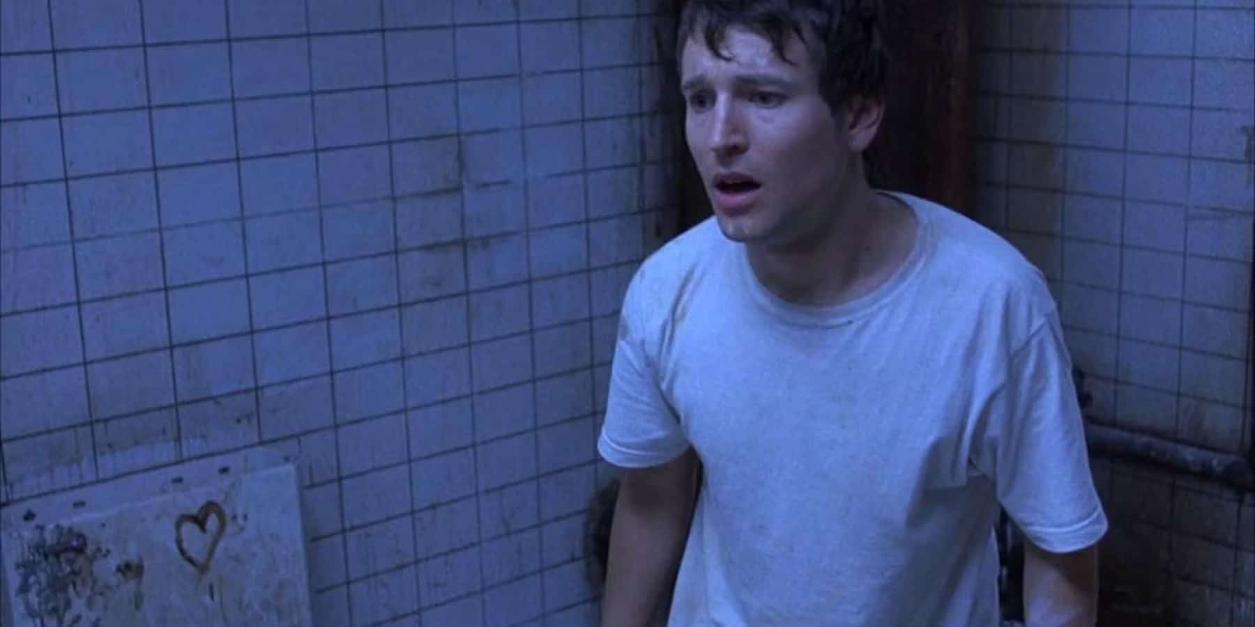 Leigh Whannell as Adam in the film, Saw (Credits: Lionsgate)