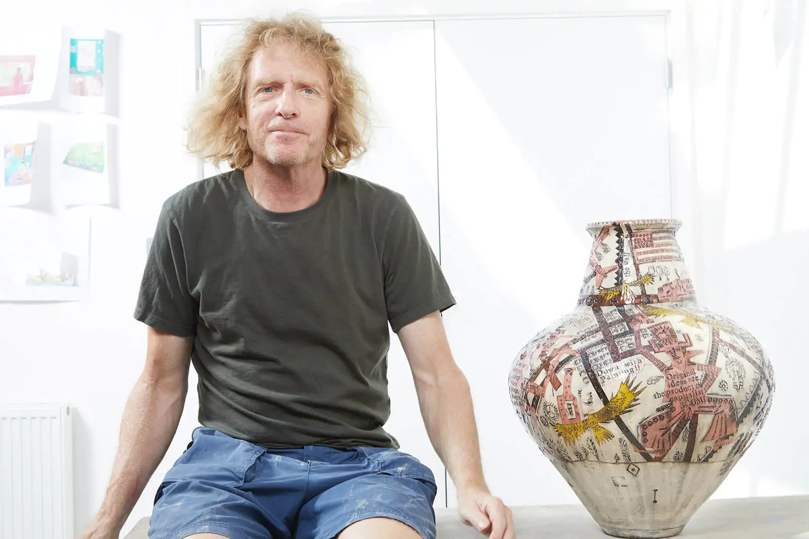Artist Grayson Perry with his ceramic vase art piece (Credits: The Design Edit)