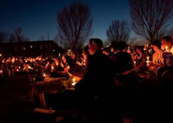 Community members participate in a candlelight vigil for Nex Benedict (Credit: YouTube)