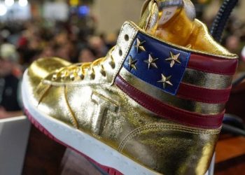 The former US President hawks $400 golden sneakers (Credit: YouTube)