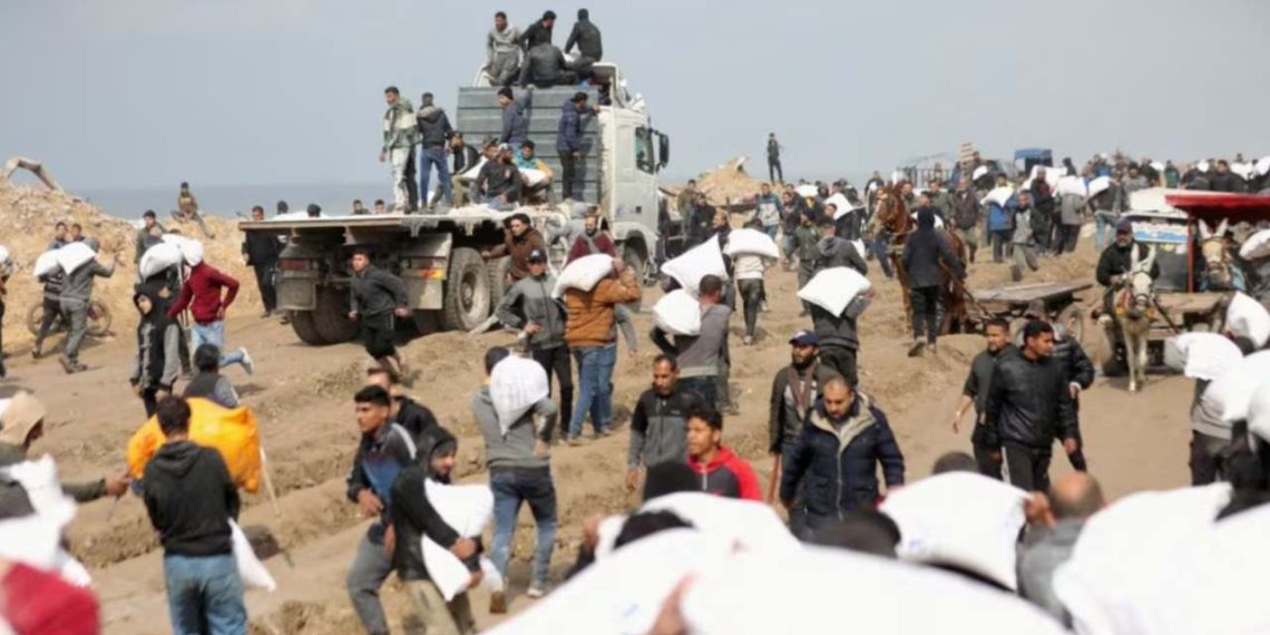 Palestinians spotted carrying flour bags as the residents of Gaza faced food crisis (Credit: Reuters)