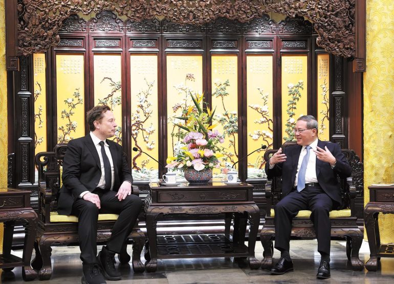 Musk's discreet visit sparks anticipation for Tesla's FSD release in China (Credits: China Daily)