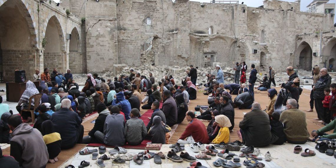Palestinians seek solace amidst the ruins on somber Eid observance (Credits: AFP)