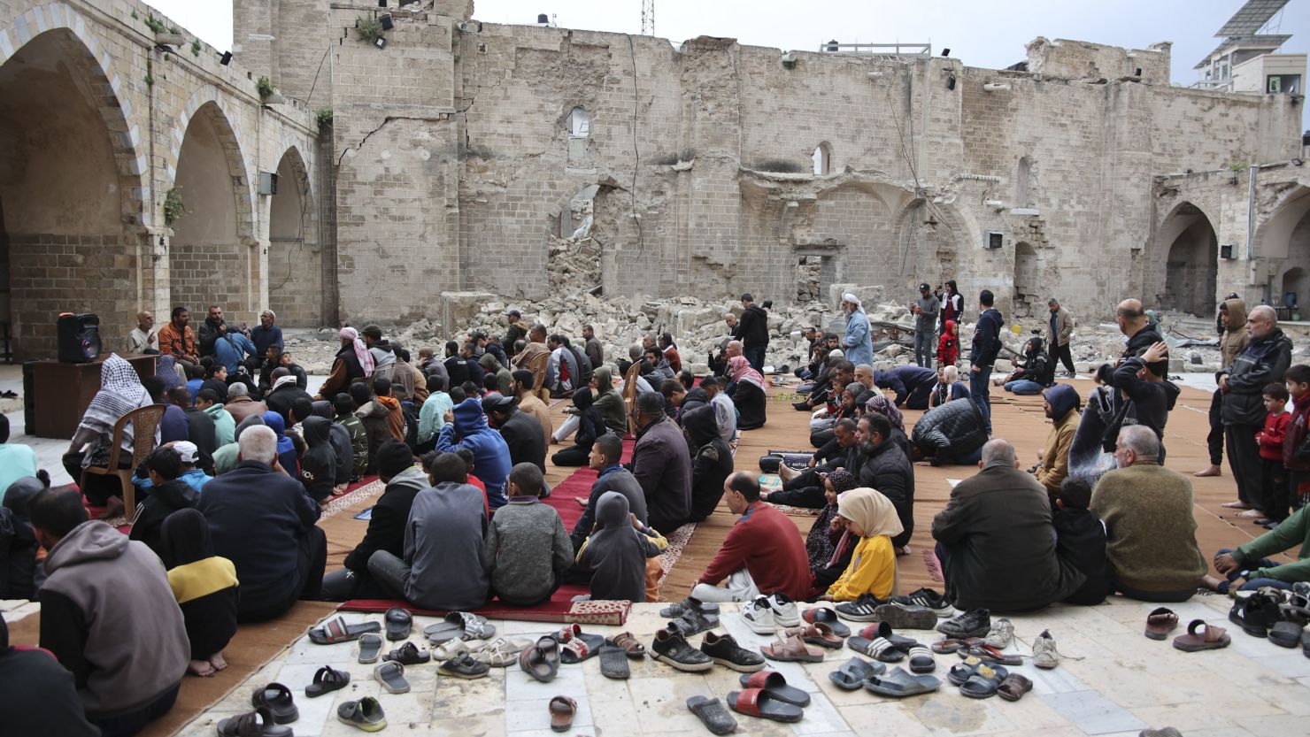 Palestinians seek solace amidst the ruins on somber Eid observance (Credits: AFP)