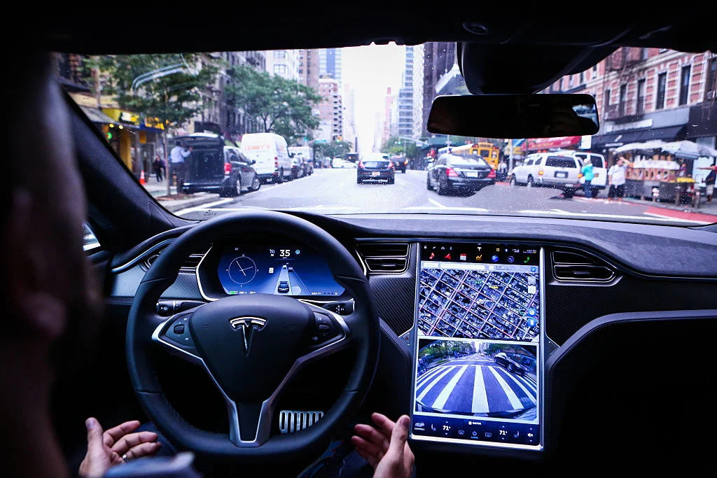 Tesla faces scrutiny over Autopilot branding and driver engagement controls (Credits: Bloomberg)