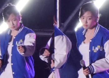Ahn Yujin addresses a male fan's behavior during IVE's performance at Incheon National University's music festival.