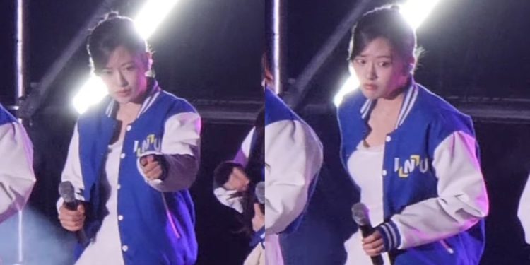 Ahn Yujin addresses a male fan's behavior during IVE's performance at Incheon National University's music festival.