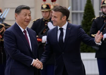 Macron urges Xi to address trade imbalances and unfair practices (Credits: AP Photo)