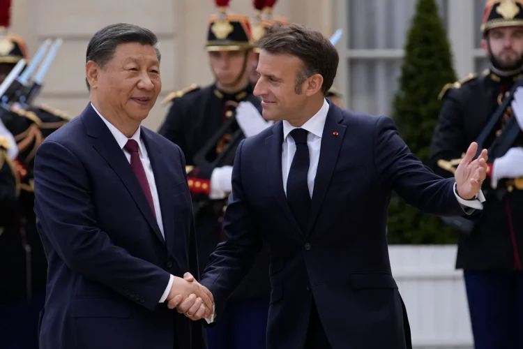 Macron urges Xi to address trade imbalances and unfair practices (Credits: AP Photo)