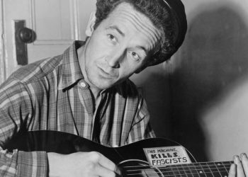 Woody Guthrie (Image via Getty)