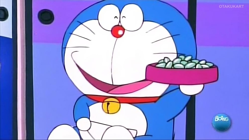 Doraemon smiles while holding a tray in a scene from the classic Doraemon anime series.