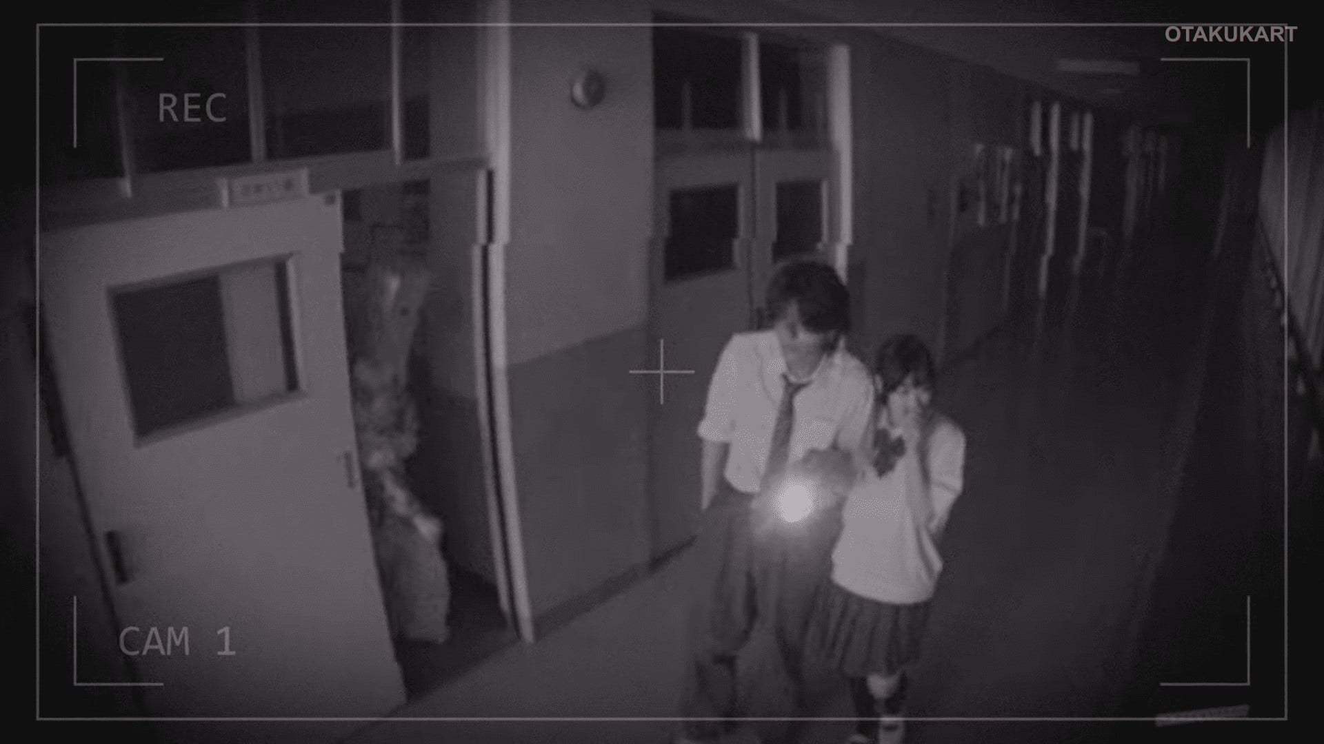Two students cautiously explore a dark school corridor as a mysterious figure emerges in Yoroi-Shinden Samurai Troopers.