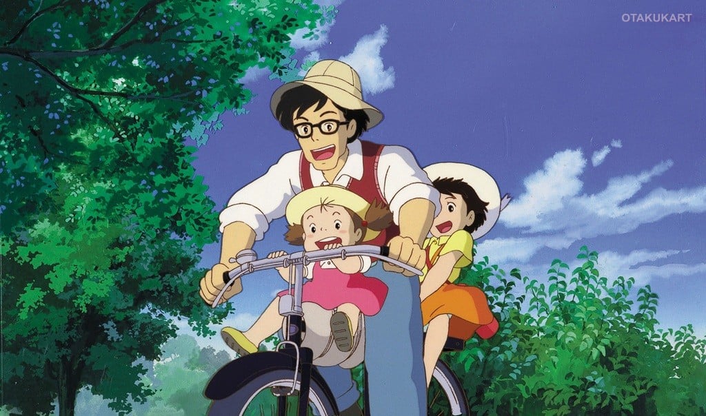 Father riding a bicycle with Satsuki and Mei through a beautiful green countryside in My Neighbor Totoro.