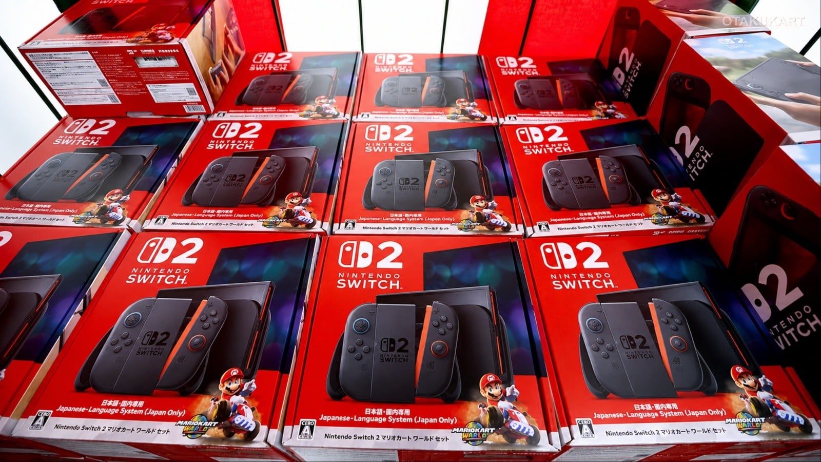 Multiple red boxes of Nintendo Switch 2 Mario Kart World Set stacked neatly on display