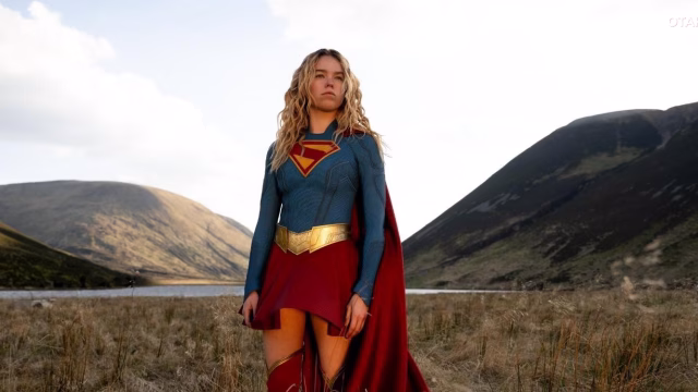 Milly Alcock as Kara Zor-El standing in the wilderness in Supergirl (Image via DC Studios and Warner Bros. Pictures)